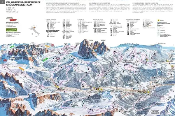 Illustrerad skidkarta över Val Gardena/Alpe di Siusi – inklusive Selva Gardena – som visar skidbackar, liftar, bergstoppar och anläggningar, med en förklaringsnyckel samt listor över backar och tjänster på flera språk. Kartan markerar rutter och höjdskillnader.